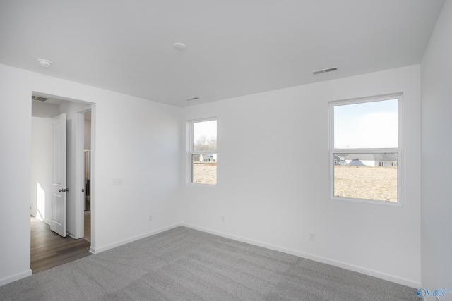 spare room featuring carpet flooring