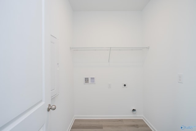 laundry room featuring washer hookup, hookup for an electric dryer, and light wood-type flooring