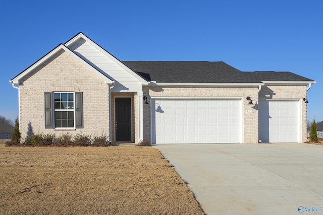 view of front facade with a garage and a front yard