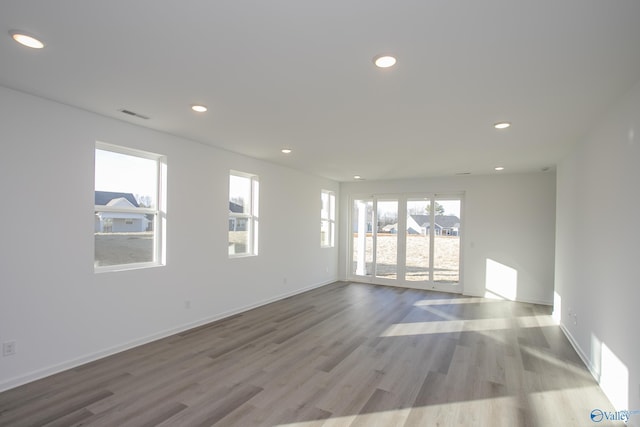 unfurnished room featuring light hardwood / wood-style flooring