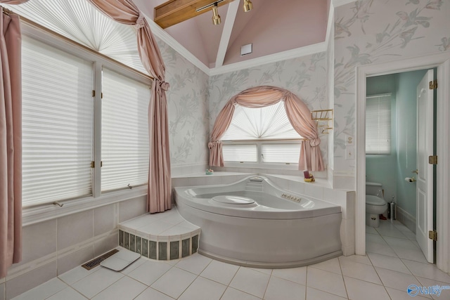 bathroom with tile patterned flooring, a bath, vaulted ceiling, and toilet