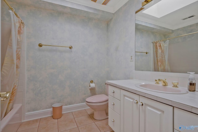 full bathroom with shower / bath combo, tile patterned flooring, a skylight, ornamental molding, and toilet