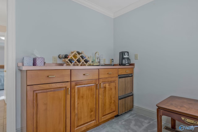 bar with sink and crown molding