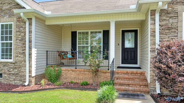 1872 Anthony Dr, Southside, AL 35907 - doorway to property with stone siding, roof with shingles, and a porch