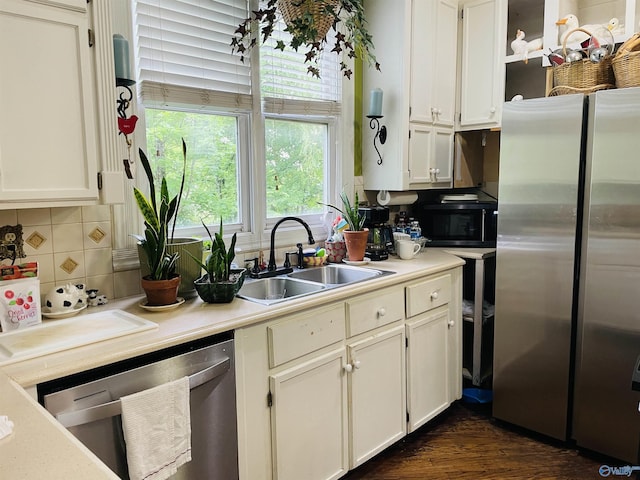 kitchen with white cabinetry, appliances with stainless steel finishes, and sink