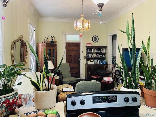 interior space with an inviting chandelier, crown molding, and plenty of natural light