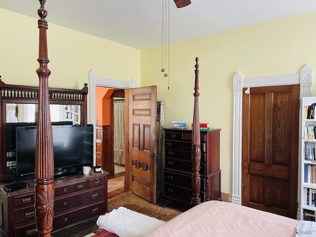 bedroom with dark wood-type flooring