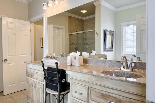 bathroom with crown molding, tile patterned floors, an enclosed shower, and vanity