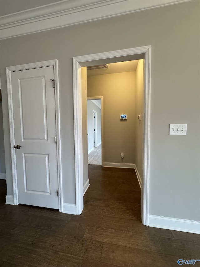 corridor with dark hardwood / wood-style floors