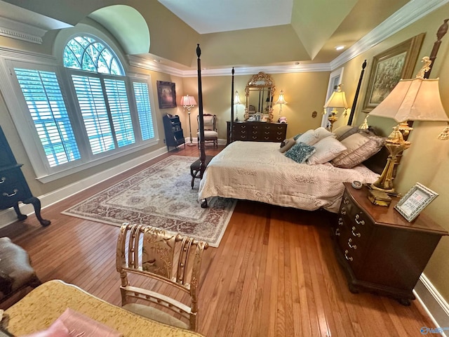 bedroom featuring hardwood / wood-style flooring and ornamental molding