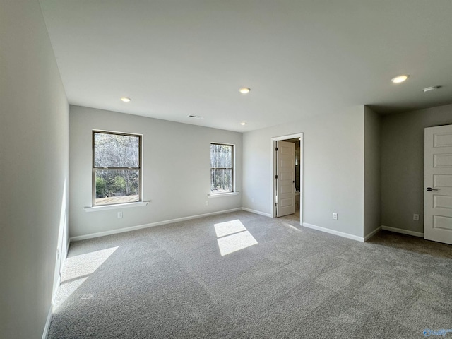 empty room with recessed lighting, baseboards, and carpet floors