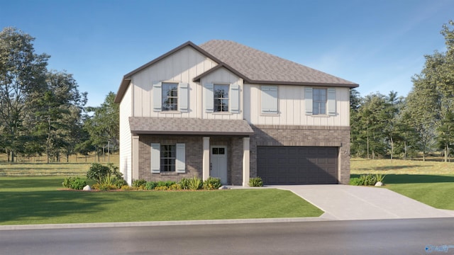 view of front of house with a front yard, a garage, brick siding, and driveway