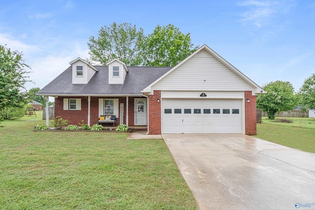 982 Bell Factory Rd, Huntsville, AL 35811 - cape cod house featuring a front yard, concrete driveway, a porch, and brick siding