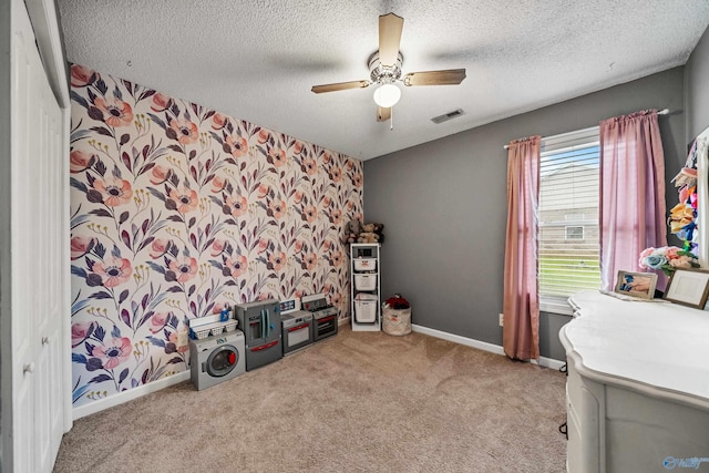 982 Bell Factory Rd, Huntsville, AL 35811 - interior space featuring a textured ceiling, carpet flooring, visible vents, baseboards, and a ceiling fan