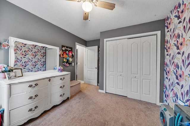 982 Bell Factory Rd, Huntsville, AL 35811 - bedroom with a closet, ceiling fan, light carpet, baseboards, and a textured ceiling