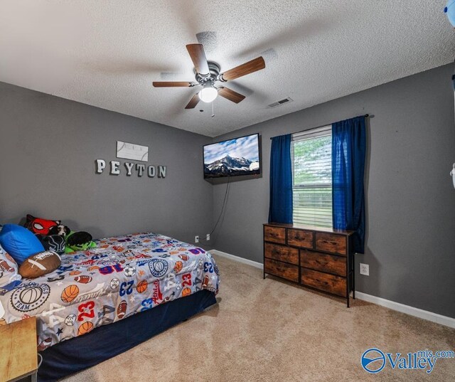 982 Bell Factory Rd, Huntsville, AL 35811 - bedroom featuring a textured ceiling, visible vents, baseboards, and carpet floors