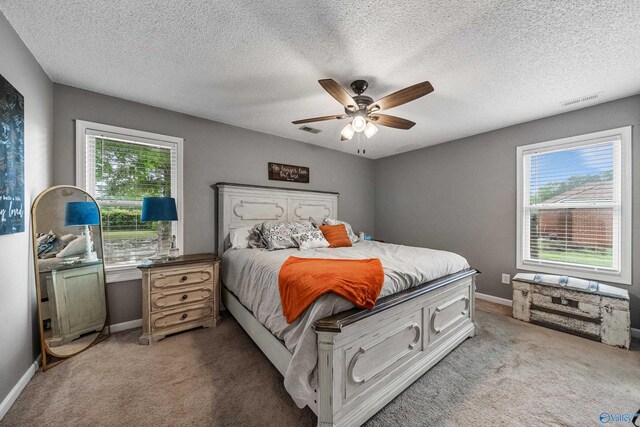 982 Bell Factory Rd, Huntsville, AL 35811 - bedroom with light colored carpet, visible vents, and baseboards