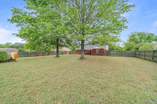 982 Bell Factory Rd, Huntsville, AL 35811 - view of yard with an outbuilding and a fenced backyard
