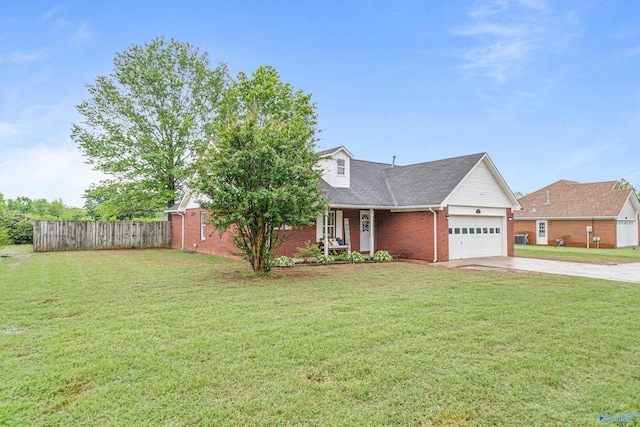 982 Bell Factory Rd, Huntsville, AL 35811 - view of front of house with a front lawn, driveway, brick siding, an attached garage, and fence