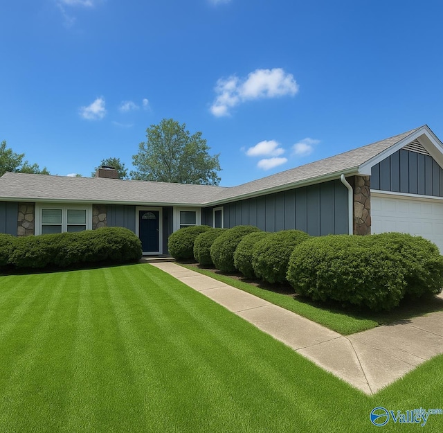 1008 Brighton Cir, Huntsville, AL 35803 - single story home with an attached garage, a front yard, a chimney, stone siding, and board and batten siding