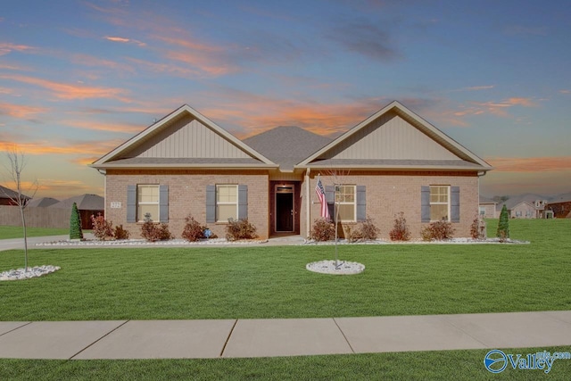 view of front of home with a lawn