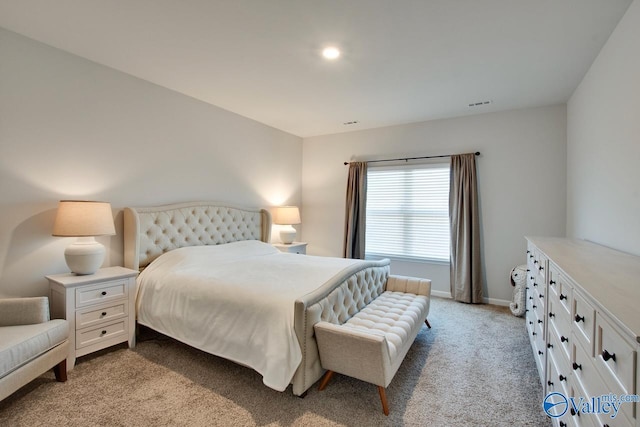 bedroom featuring light carpet