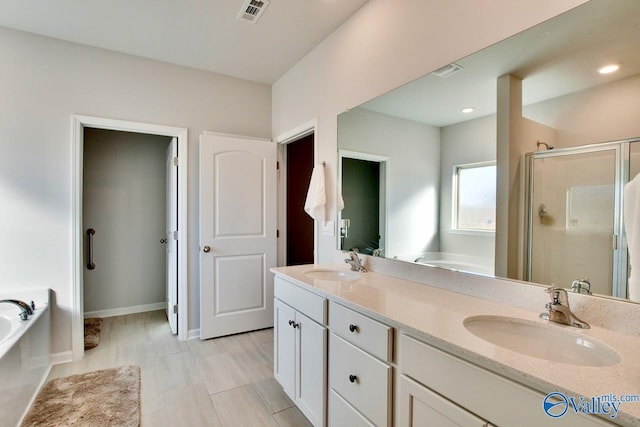 bathroom with vanity and plus walk in shower