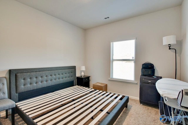 bedroom with light colored carpet