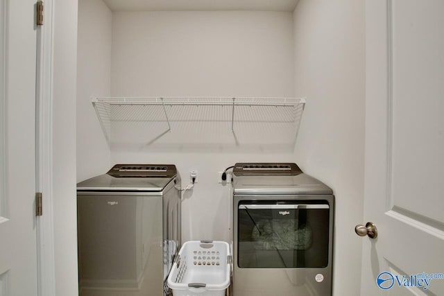 laundry area featuring washing machine and clothes dryer