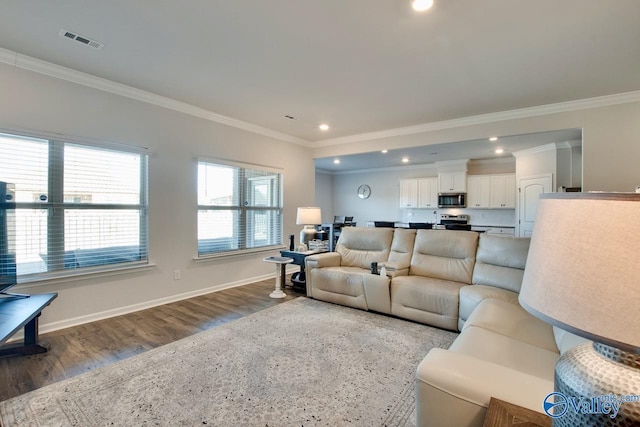 living room with ornamental molding and hardwood / wood-style flooring