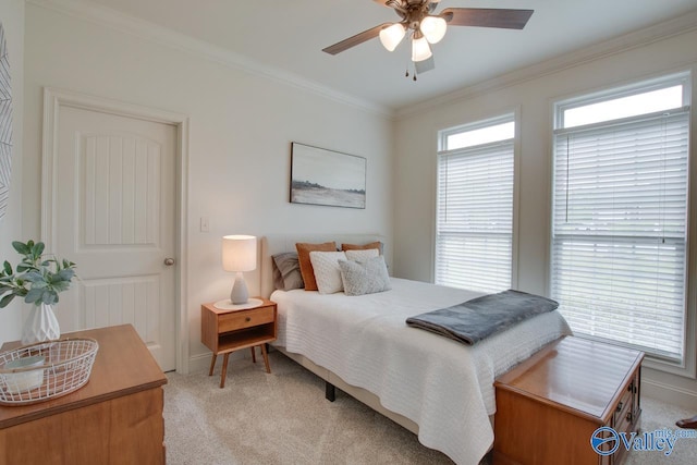 bedroom with light colored carpet, ceiling fan, and ornamental molding