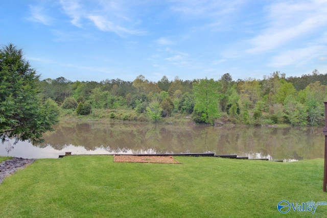 property view of water featuring a forest view