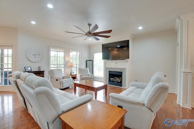 living area featuring recessed lighting, ceiling fan, a wealth of natural light, and a fireplace