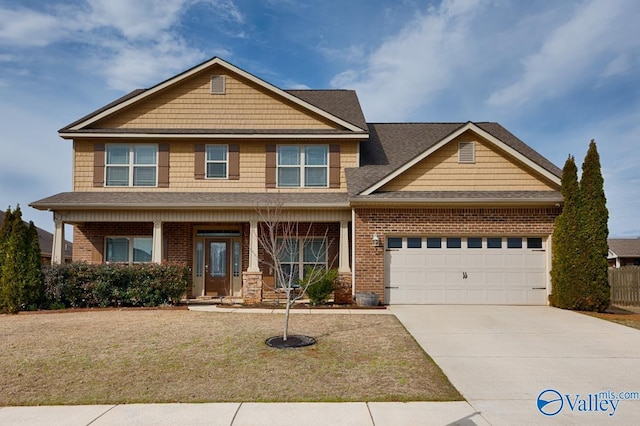 craftsman-style house with an attached garage, a front yard, concrete driveway, and brick siding