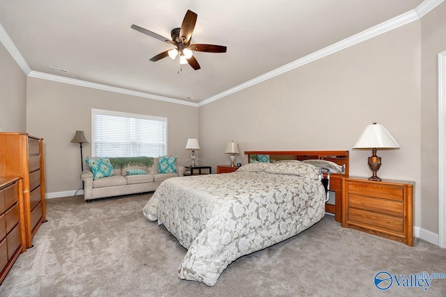 carpeted bedroom featuring ornamental molding, ceiling fan, and baseboards