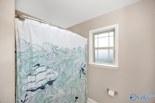 full bathroom with a shower with shower curtain