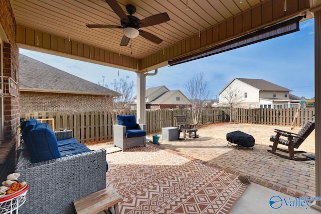 view of patio / terrace with a fenced backyard and a ceiling fan