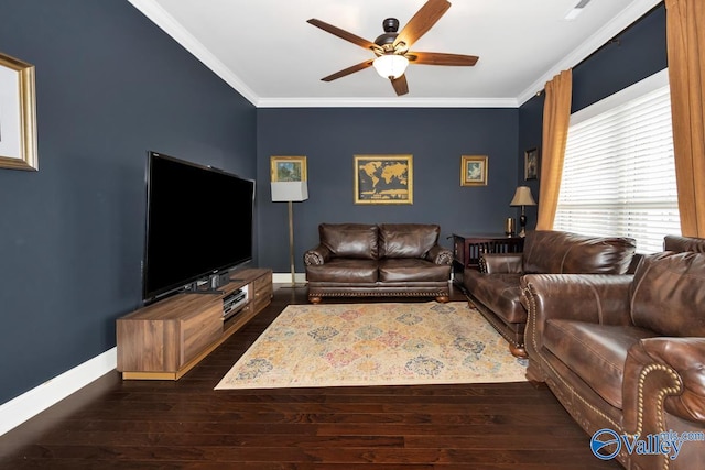 living room featuring dark wood-style floors, ceiling fan, baseboards, and crown molding