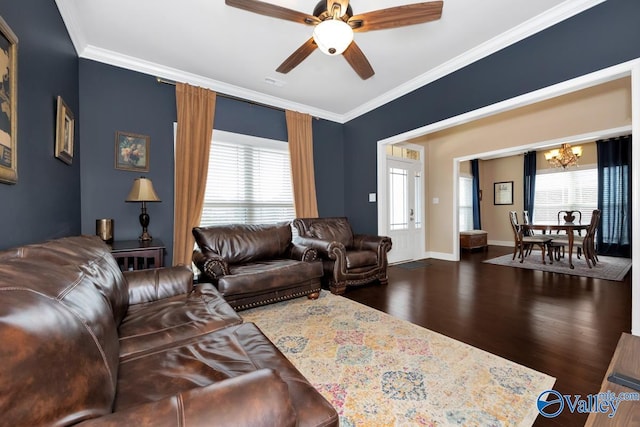 living room featuring ornamental molding, wood finished floors, and a healthy amount of sunlight