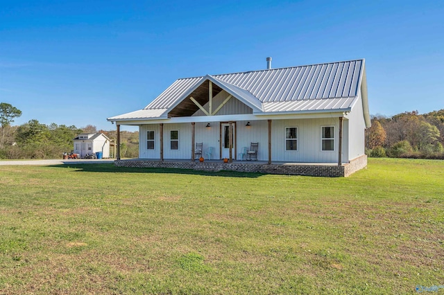 view of front of home with a front lawn and a porch