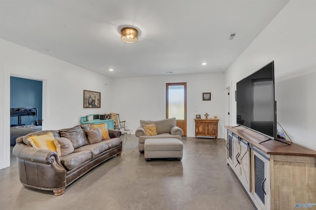 living room featuring concrete floors