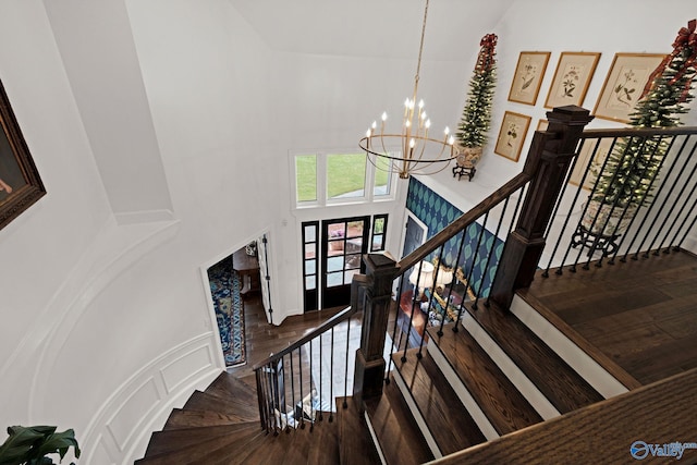 1176 N Lake Forest Dr, Southside, AL 35907 - stairway with a high ceiling, wood finished floors, and an inviting chandelier