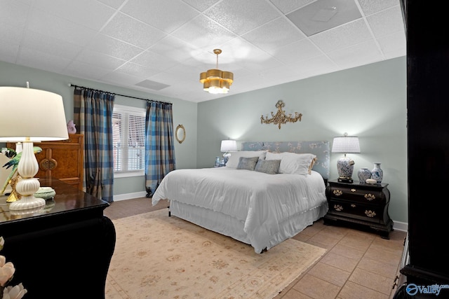 1176 N Lake Forest Dr, Southside, AL 35907 - bedroom featuring baseboards, light tile patterned flooring, and a drop ceiling
