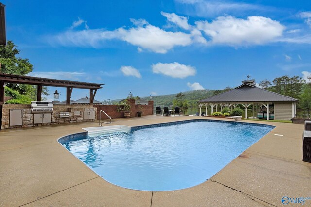 1176 N Lake Forest Dr, Southside, AL 35907 - view of pool with exterior kitchen, a patio area, a gazebo, and a fenced in pool