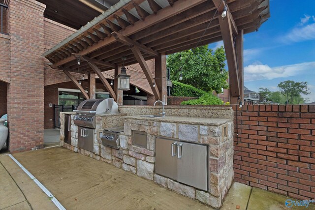 1176 N Lake Forest Dr, Southside, AL 35907 - view of patio featuring a grill, a sink, and area for grilling