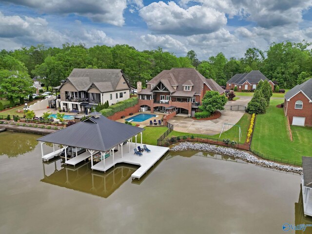 1176 N Lake Forest Dr, Southside, AL 35907 - view of dock with fence, a water view, boat lift, a patio, and a lawn