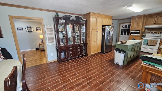 kitchen featuring ornamental molding, wood tiled floor, a textured ceiling, white appliances, and under cabinet range hood