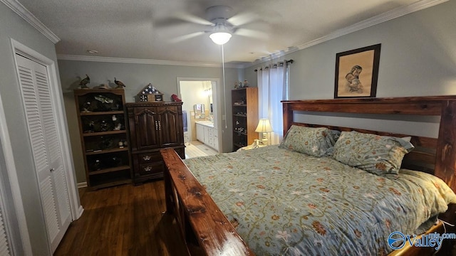 bedroom featuring wood finished floors, a ceiling fan, ornamental molding, a closet, and ensuite bath