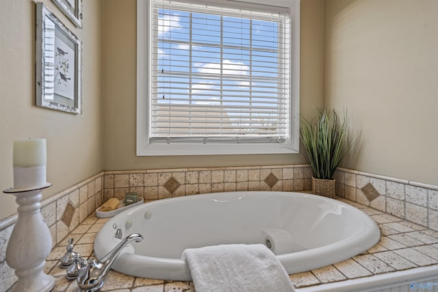 bathroom featuring a healthy amount of sunlight and a bathing tub