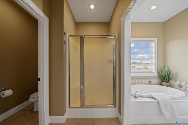 bathroom featuring separate shower and tub, tile patterned floors, and toilet